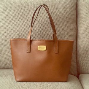 Medium size brown Michael Kors shoulder purse.